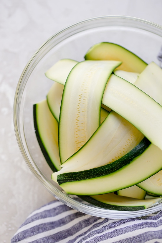 These Zucchini Chicken Enchilada Roll Ups are filled seasoned shredded chicken, topped with enchilada sauce and cheese. Delicious, and perfect for Keto, gluten-free or low-carb diets.