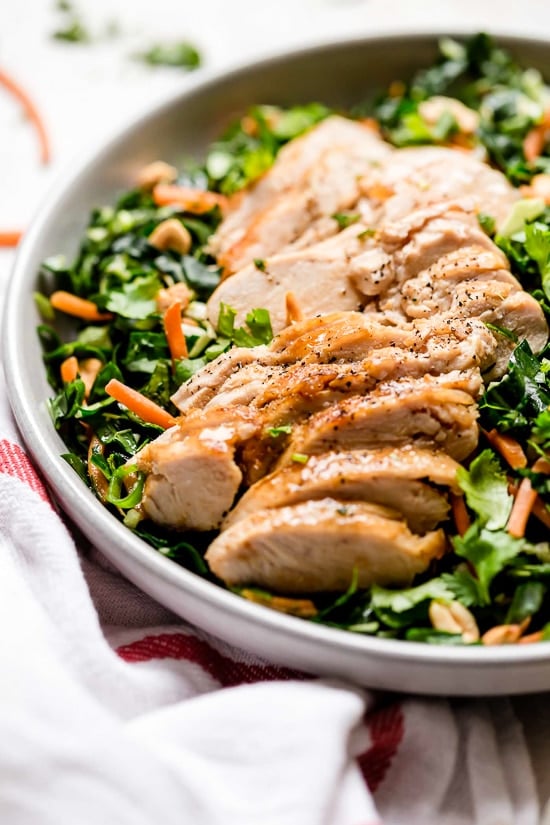 Houston’s (Lightened-Up) Kale Salad with Peanut Vinaigrette is satisfying, made with a combo of grilled chicken, kale, cabbage, carrots, peanuts, scallions, cilantro and mint tossed in a light peanut-sesame dressing. 