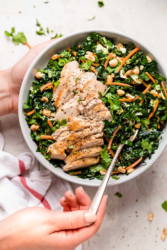 Houston’s (Lightened-Up) Kale Salad with Peanut Vinaigrette is satisfying, made with a combo of grilled chicken, kale, cabbage, carrots, peanuts, scallions, cilantro and mint tossed in a light peanut-sesame dressing.