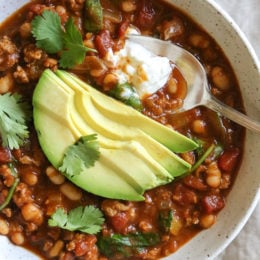 Turkey Pumpkin Chili is the perfect Fall dish made with ground turkey, tomatoes, canned pumpkin, white beans and spinach.