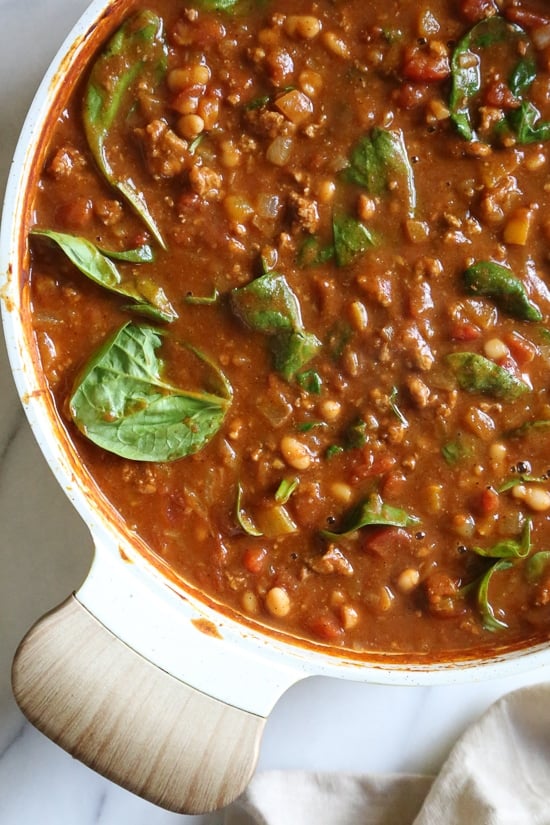Turkey Pumpkin Chili is the perfect Fall dish made with ground turkey, tomatoes, canned pumpkin, white beans and spinach.