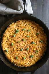 Overhead view of crispy hash browns in cast iron skillet