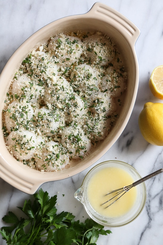 These quick and easy baked sea scallops are topped with panko and Parmesan in a simple lemon-butter sauce.