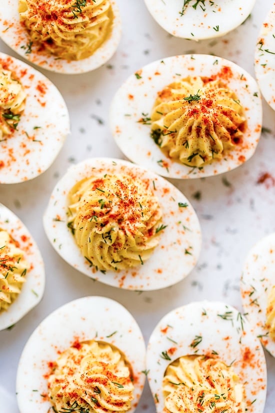 These Instant Pot Deviled Eggs are quick and easy, with a creamy egg yolk filling and a hint of paprika on top. Perfect for potlucks! Overhead view of Instant Pot deviled eggs