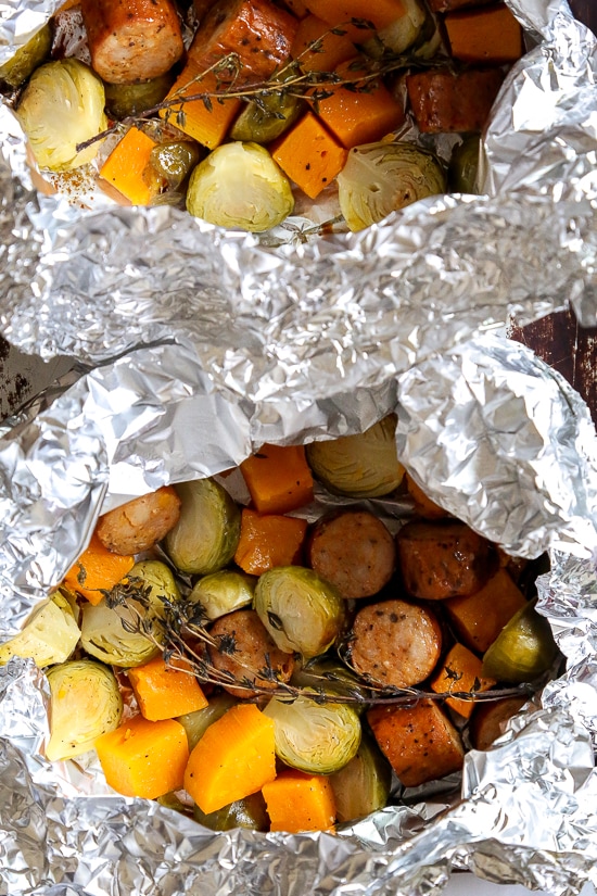 An easy Fall foil packet dinner made with spicy chicken Andouille sausage, Brussels sprouts and butternut squash. It's the perfect balance of spicy, smokey and sweet in every bite!