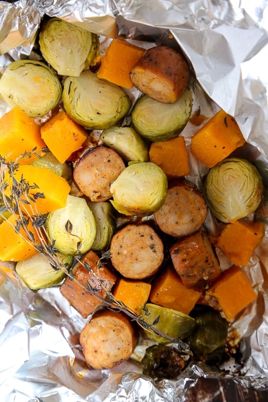An easy Fall foil packet dinner made with spicy chicken Andouille sausage, Brussels sprouts and butternut squash. It's the perfect balance of spicy, smokey and sweet in every bite!