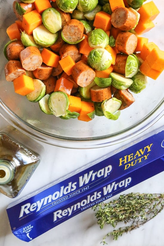An easy Fall foil packet dinner made with spicy chicken Andouille sausage, Brussels sprouts and butternut squash. It's the perfect balance of spicy, smokey and sweet in every bite!