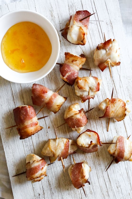 Bacon wrapped chicken bites are the easiest appetizer, made with just TWO ingredients. Using the air fryer, the bacon comes out crisp on the outside, and the chicken juicy and tender inside. 