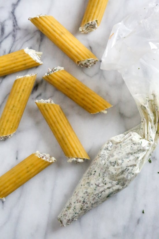 This easy no-boil baked manicotti pasta dish, known as Cannelloni is stuffed with ricotta, parmesan, mozzarella and lean ground beef, then covered in sauce and cheese. Perfect for the holidays, for to bring to a potluck or to enjoy any night of the week!