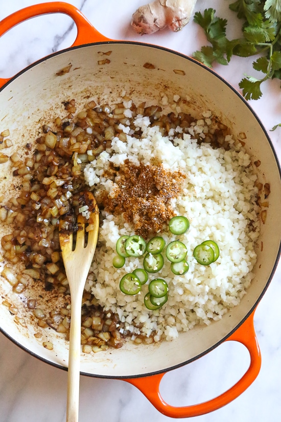 This quick and easy Indian-inspired skillet dish, is a low-carb take on Chicken Biryani, made with riced cauliflower in place of rice. It's also Keto, gluten-free and Whole30 compliant.
