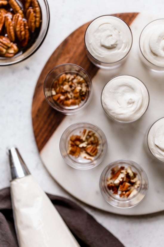 Sticking with my philosophy of eating smaller portions, I love to make desserts in shot glasses like these Maple Pecan Cheesecake Shooters!