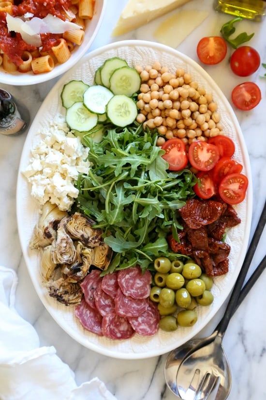 For fuss free entertaining, nothing is easier (or prettier) than creating an antipasto salad platter where everyone can help themselves.