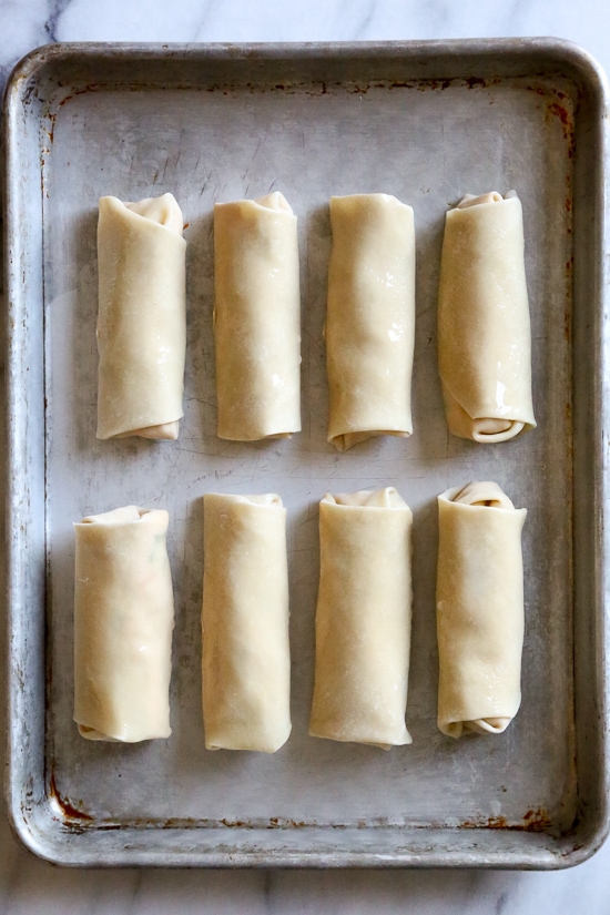 These Buffalo Chicken Egg Rolls, filled with shredded boneless chicken breast, hot sauce and blue cheese make the perfect appetizer! Bake them in the oven or air fryer!