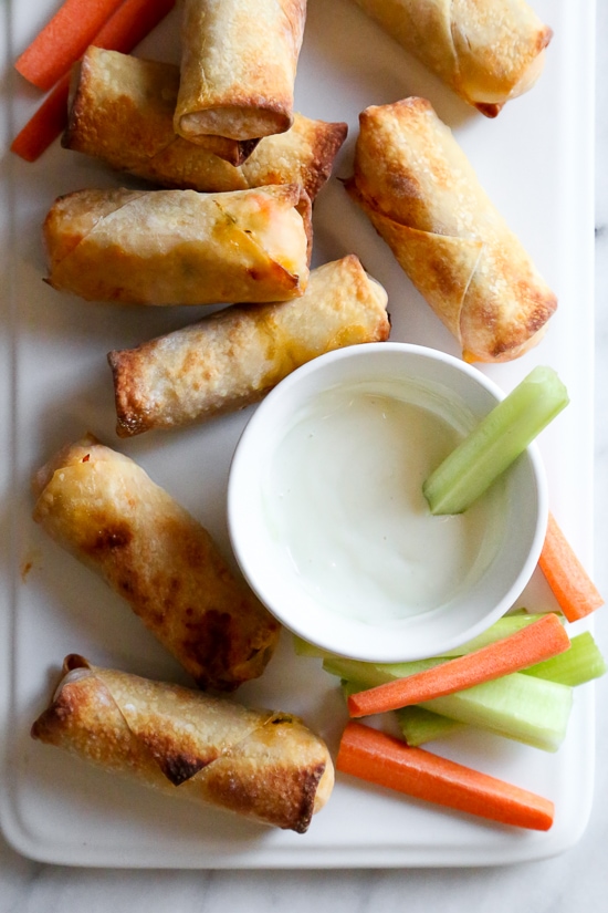 These Buffalo Chicken Egg Rolls, filled with shredded boneless chicken breast, carrots, scallions, hot sauce and blue cheese make the perfect appetizer! Bake them in the oven or air fryer!