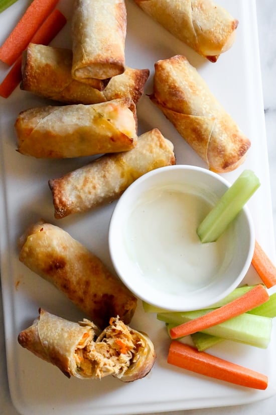 These Buffalo Chicken Egg Rolls, filled with shredded boneless chicken breast, carrots, scallions, hot sauce and blue cheese make the perfect appetizer! Bake them in the oven or air fryer!