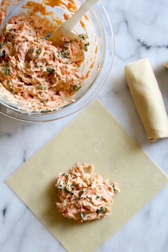 These Buffalo Chicken Egg Rolls, filled with shredded boneless chicken breast, hot sauce and blue cheese make the perfect appetizer! Bake them in the oven or air fryer!