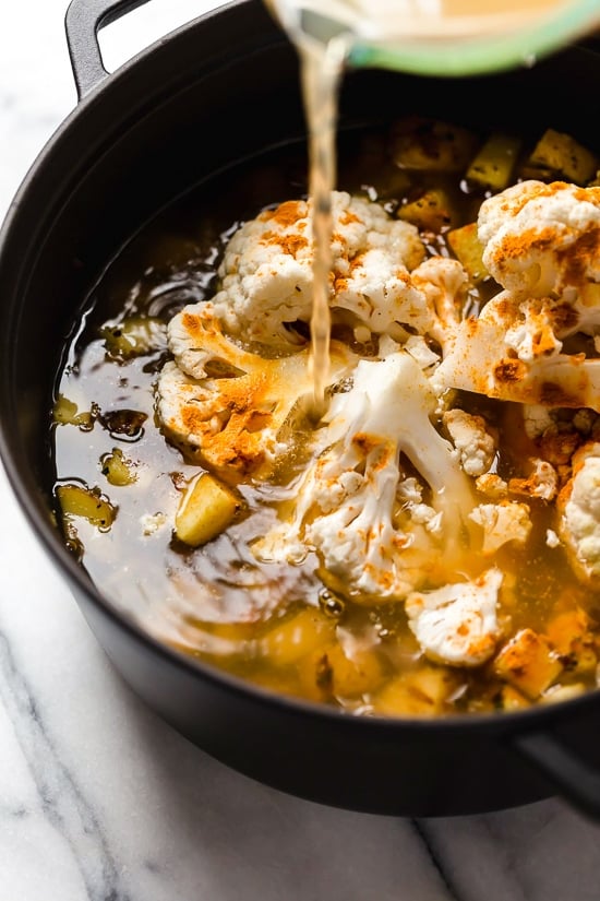 This thick and cheesy chowder with potatoes, corn, cauliflower, and bacon is perfect for cold and cozy winter nights.