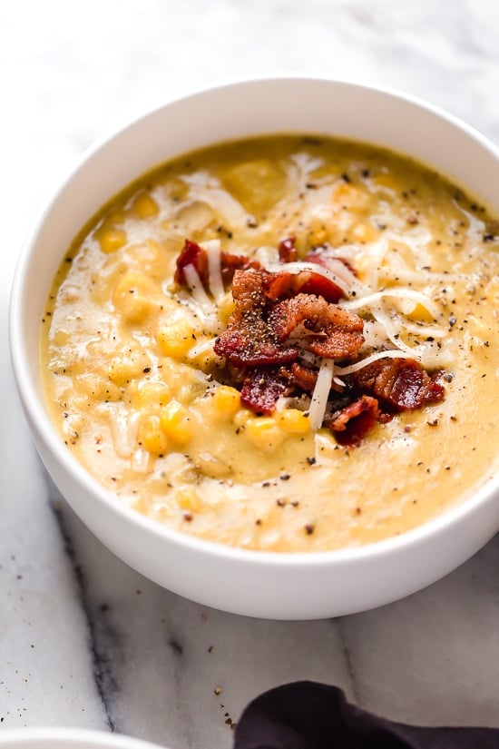This thick and cheesy Cheddar Corn Chowder with Bacon is made light using cauliflower to thicken it, no cream added. Stove top and Instant Pot directions.