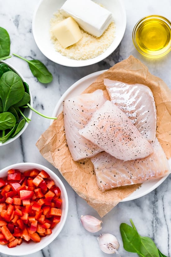 This easy Fish Florentine recipe, made with a pan seared firm white fish served on a creamy bed of spinach feels like something you would order out in a fancy restaurant!