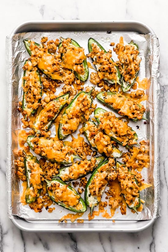 Keto Nachos Jalapeno Poppers meet nachos in this fun, low-carb twist of two classic appetizers, perfect for sharing!