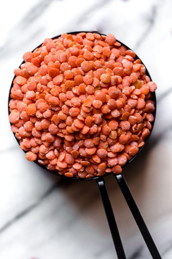 This delicious, Middle Eastern inspired Lentil Soup, made with red lentils, turmeric, spinach, carrots and lemon will exceed your expectations. It's golden in color, and very easy to make and leftovers are freezer-friendly.