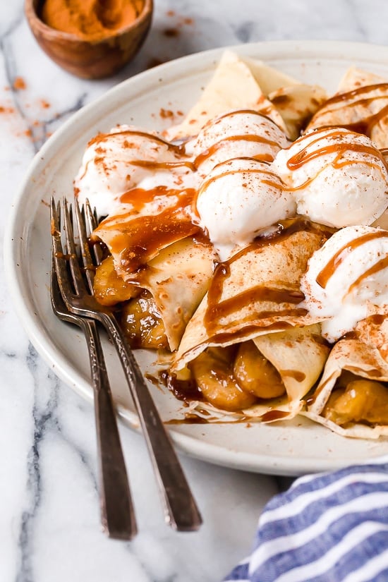 Banana Foster Crepes combine two of my favorite desserts – homemade crepes and bananas fosters! This slimmed down make-over is delicious and perfect anytime you're craving something sweet!