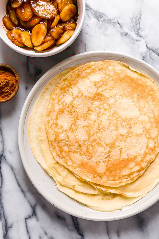 Banana Foster Dessert Crepes are made with two of my favorite desserts – homemade crepes and bananas fosters, combined into one! This skinny make-over won't wreak havoc on your weekly calorie intake.