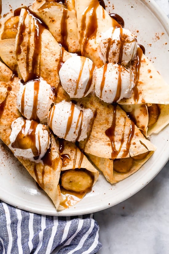 Banana Foster Crepes combine two of my favorite desserts – homemade crepes and bananas fosters! This slimmed down make-over is delicious and perfect anytime you're craving something sweet!