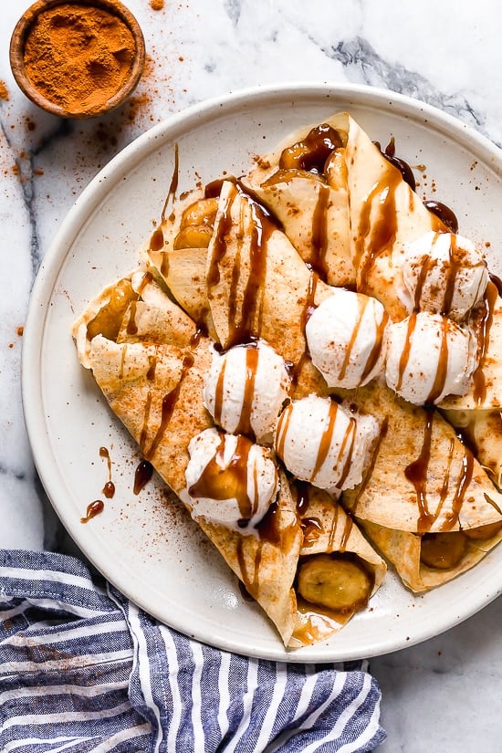 Banana Foster Dessert Crepes are made with two of my favorite desserts – homemade crepes and bananas fosters, combined into one! This skinny make-over won't wreak havoc on your weekly calorie intake.