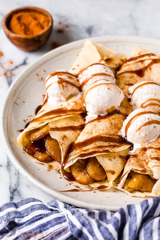 Banana Foster Crepes combine two of my favorite desserts – homemade crepes and bananas fosters! This slimmed down make-over is delicious and perfect anytime you're craving something sweet!