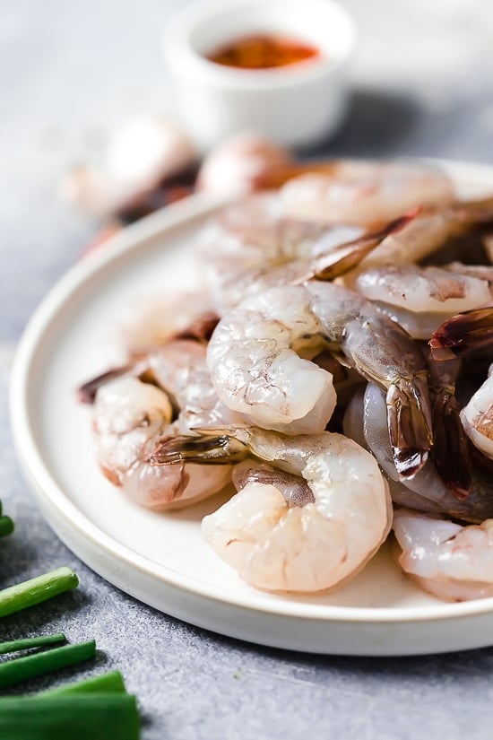 For a quick and easy weeknight dinner, you will love this easy Asian Honey Garlic Shrimp recipe! It’s sweet, spicy, savory, and so good. Jumbo shrimp on plate