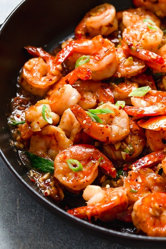 For a quick and easy weeknight dinner, you will love this easy Asian Honey Garlic Shrimp recipe! It’s sweet, spicy, savory, and so good. Honey garlic shrimp in skillet