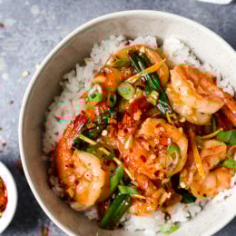 Top-down view of honey garlic shrimp in bowl of rice