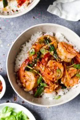 Top-down view of honey garlic shrimp in bowl of rice