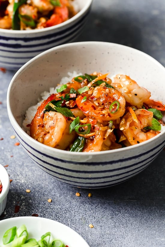 For a quick and easy weeknight dinner, you will love this easy Asian Honey Garlic Shrimp recipe! It’s sweet, spicy, savory, and so good. Honey garlic shrimp served over rice in bowl