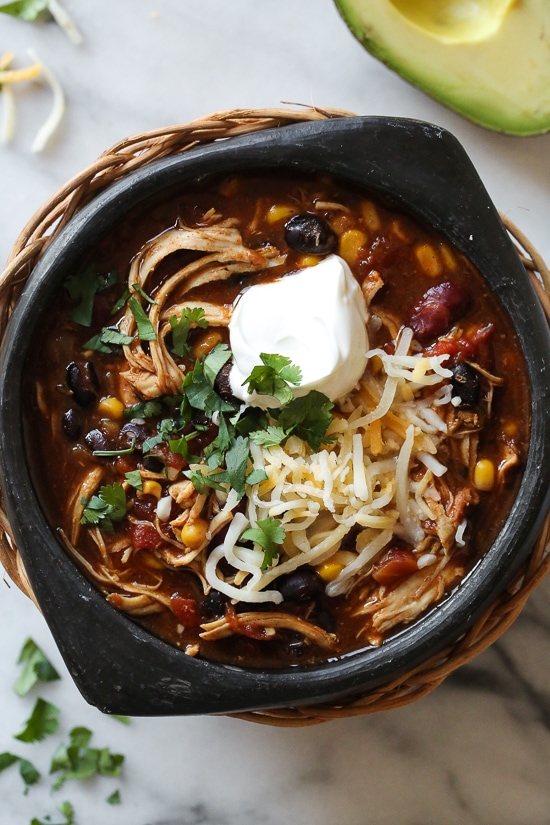 This easy and healthy Instant Pot Chicken Taco Chili is made with chicken, beans, corn and tomatoes and taco seasoning. Chicken Taco Chili, made with chicken, beans, corn and tomatoes seasoned with taco seasoning is one of my most popular slow cooker recipes, which I just remade for Instant Pot after several requests! This recipe couldn’t be easier, made with ingredients you probably already have in your pantry.