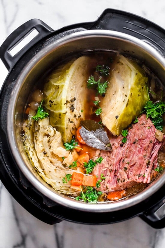 This easy Instant Pot Corned Beef and Cabbage recipe comes out perfectly tender every time! The perfect St. Patrick's Day dinner. Corned beef, cabbage, and carrots in an Instant Pot.