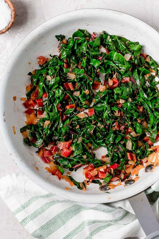 I love this lighter take on Eggs Benedict made with Canadian bacon, Swiss chard and poached eggs on a whole wheat English muffin. Perfect for breakfast or brunch!