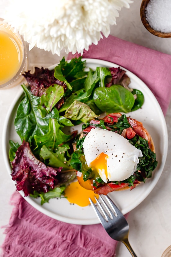 I love this lighter take on Eggs Benedict made with Canadian bacon, Swiss chard and poached eggs on a whole wheat English muffin. Perfect for breakfast or brunch!