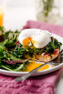 I love this lighter take on Eggs Benedict made with Canadian bacon, Swiss chard and poached eggs on a whole wheat English muffin. Perfect for breakfast or brunch!