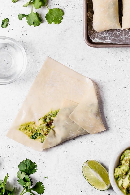 These Avocado Egg Rolls are inspired by the Cheesecake Factory egg rolls, only healthier because they are not fried. An easy air fryer recipe or bake them in the oven!