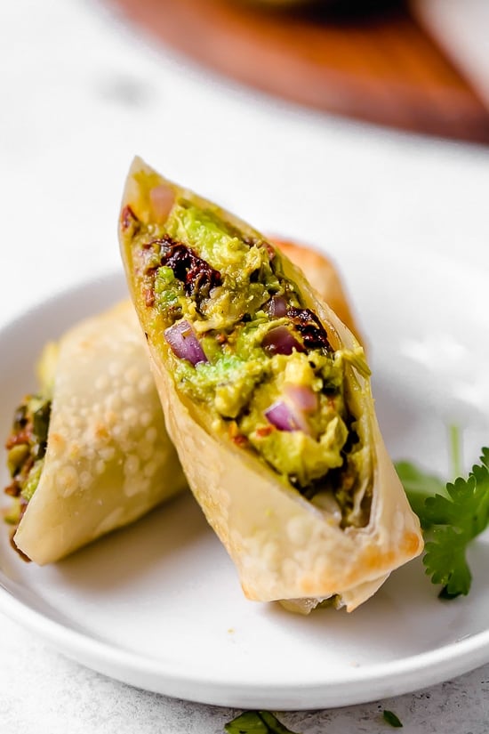 These Avocado Egg Rolls are inspired by the Cheesecake Factory egg rolls, only healthier because they are not fried. An easy air fryer recipe or bake them in the oven!