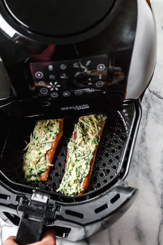 I'm obsessed with this Air Fryer Basil-Parmesan Salmon recipe! Making salmon in the air fryer is quick and easy, and the fish comes out so juicy inside.