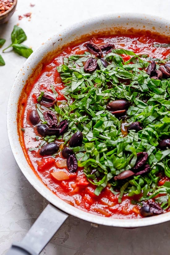 This healthy Mediterranean Sea Bass is smothered in a piquant, healthy, Mediterranean-inspired sauce made from tomatoes, white wine, fennel and olives.