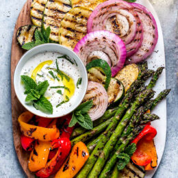 Grilled Vegetables with Yogurt Mint Sauce is so colorful and delicious. An easy summer side dish made with asparagus, zucchini, squash, red onion and bell peppers.