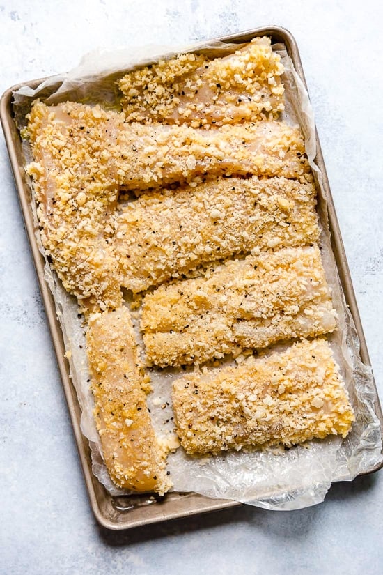 Tzatziki Fish Tacos have a Greek twist! Made with breaded white fish filet topped with mint tzatziki sauce.