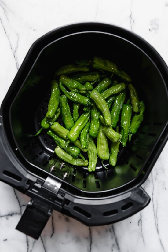 Blistered Shishito peppers are usually stir-fried in a wok or skillet. Since you're using less oil in the air fryer, these are much healthier, less messy and so easy!