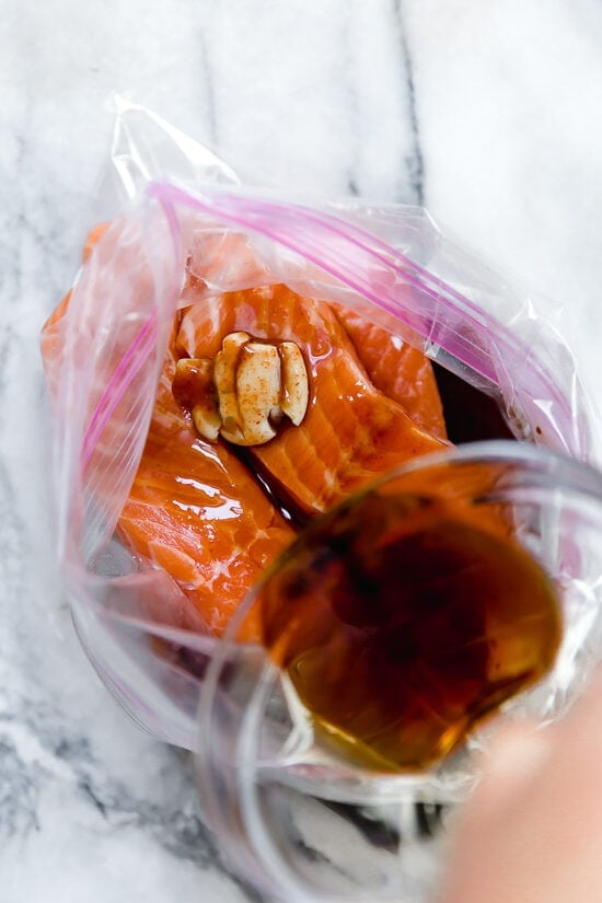 Marinate the salmon with maple soy marinade.