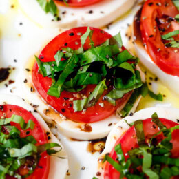 Caprese salad arranged on platter