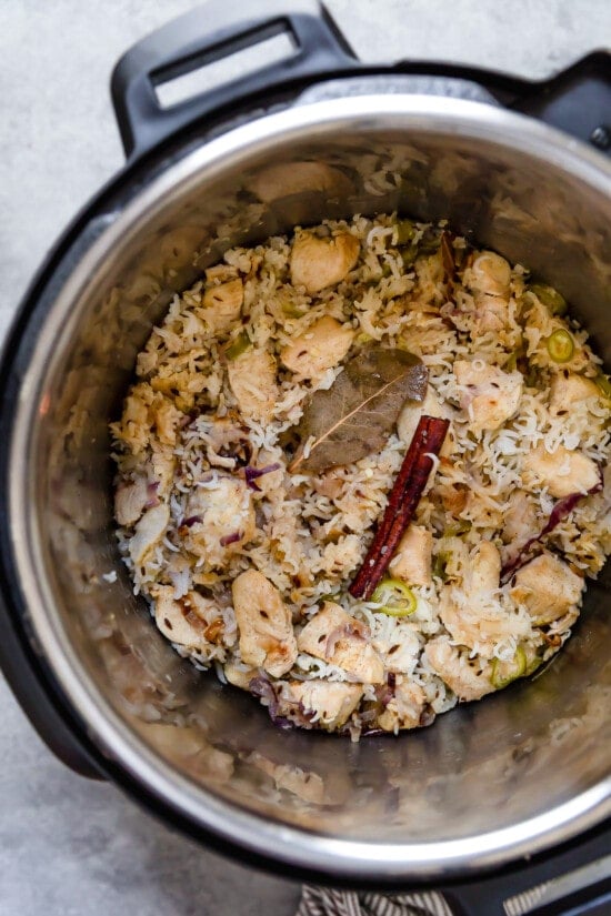 Instant Pot Chicken Pulao comes together in just 30 minutes, with basmati rice, chicken breasts, and a few aromatics and spices. Chicken pulao ingredients in an Instant Pot